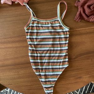 Retro 70s 80s 90s one piece bodysuit with snap enclosure